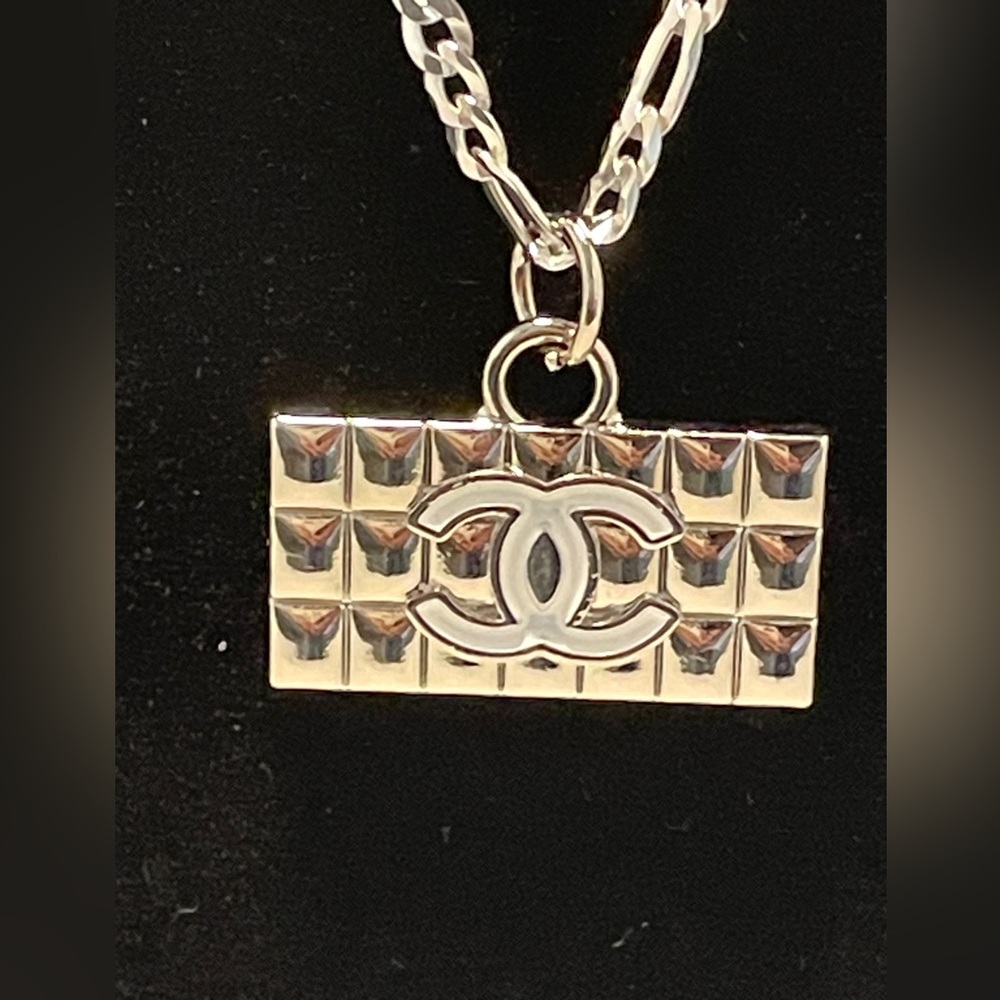 AUTHENTIC Chanel charm strung on brand new solid sterling silver chain